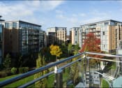 Thumbnail 2 of 6 - a view of apartment buildings from a balcony