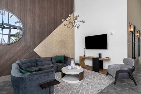 a living room with a couch and a table and a television