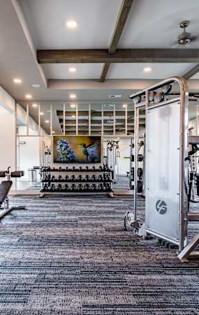 the gym at the enclave at woodbridge apartments in sugar land, tx