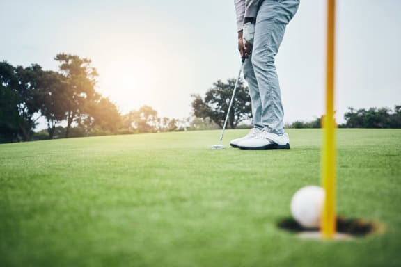 a man playing golf on the golf course