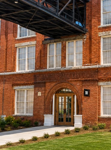 a large window with a chair and a table in front of it at The Mill at Prattville, Alabama