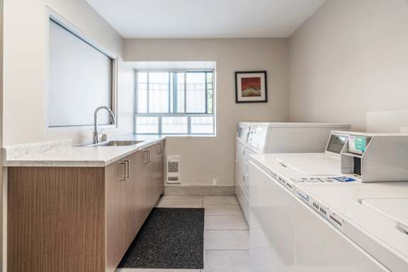 A laundry room with a washer and dryer. at 608 Church Apartments, Toronto, ON, M4Y 2E7