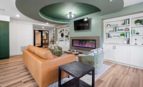 a living room with a couch and a fireplace at Edgebrook Residences, New Hampshire