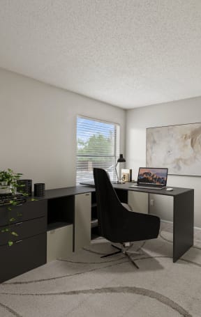 an office with a desk and a chair in a room with a bookcase