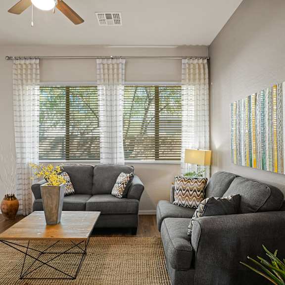 a living room with two couches and a coffee table at Bella Grace, Chandler, 85225