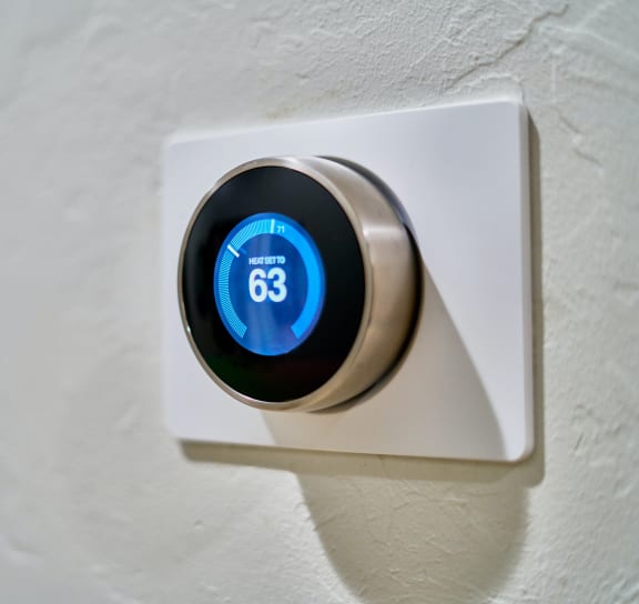 a smart thermostat on a wall