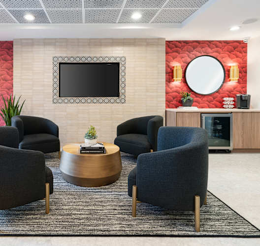 Waiting room with red wallpaper at Vera Cortez Hill, San Diego, CA, 92101