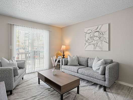 a living room with couches and a coffee table