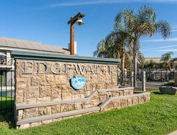 a stone building with the edgewood water logo on it