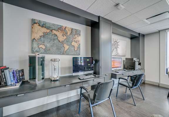 a room with two desks and two computer monitors at Infinity Edgewater, Edgewater, 07020