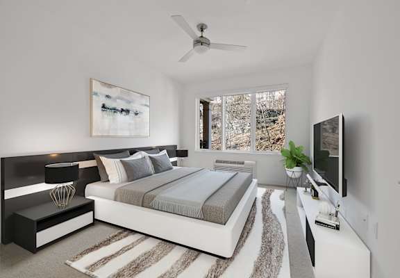 Bedroom With Ceiling Fan at Infinity Edgewater, Edgewater