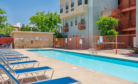 our apartments have a large swimming pool with lounge chairs
