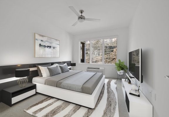 Bedroom With Ceiling Fan at Infinity Edgewater, Edgewater