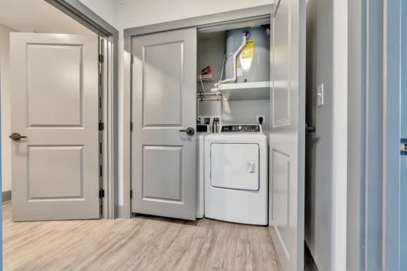 a laundry room with a washer and dryer
