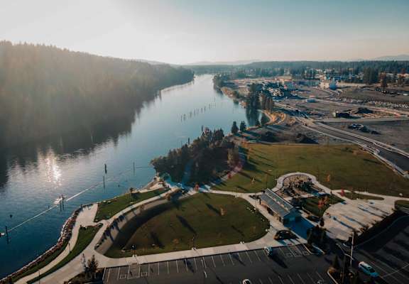 a river flowing through a city next to a body of water