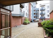 Thumbnail 6 of 6 - the view of an empty courtyard from an apartment building
