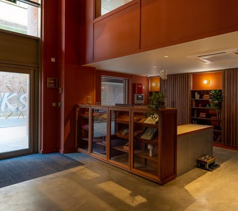 the lobby of a building with a reception desk