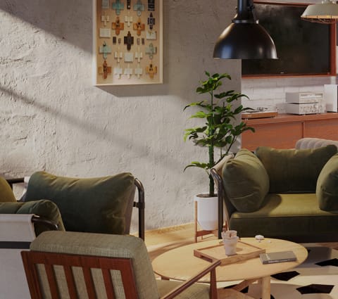 a living room with green couches and a coffee table