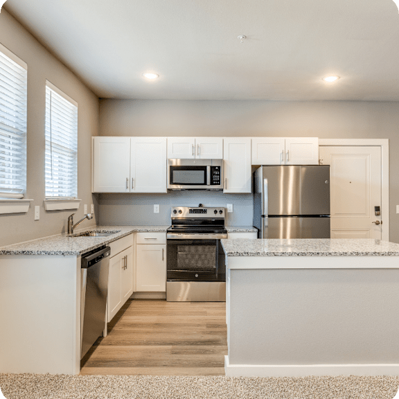 Four Cedars Apartments in Gunter, TX Kitchen with Island