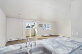 A kitchen with a marble countertop and a double sink. at Ironwood Apartments, Coeur dAlene, ID, 83814
