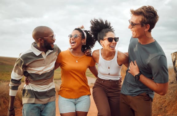 a group of young people laughing and smiling together