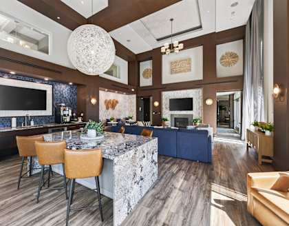 A modern kitchen with a dining table and chairs.