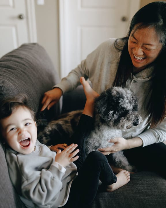 family with pet at paddock village apartments