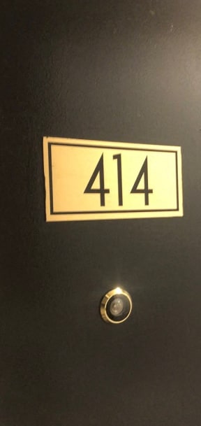 the door to the 414 elevator has the number 414 on it