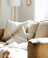 a bedroom with a bed and pillows