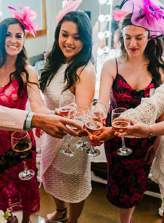 Four women wearing bunny ears toasting with wine glasses. at Northlake Park Apartments, Orlando