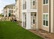 Thumbnail 10 of 25 - Modern apartment homes with private balconies, attractive exterior finishes, and beautifully maintained landscaping.