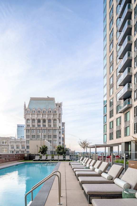 A large swimming pool with steps leading into it.