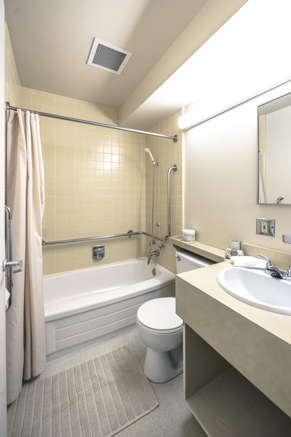 a bathroom with a toilet sink and bathtub