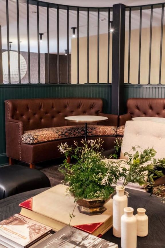 a living room filled with furniture and a table