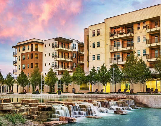 Discovery at The Realm Apartments in Lewisville, TX Exterior and Waterfall