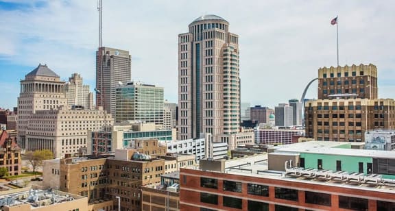 a view of the skyline of a city with tall buildings