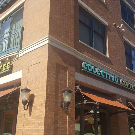A brick building with a sign that says Selecto Coffee. at Cornerstone & Ravenna* Apartments, Shorewood, Wisconsin
