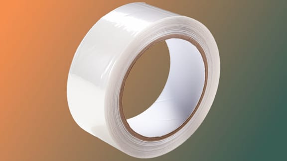 A roll of white tape is placed against a gradient background.