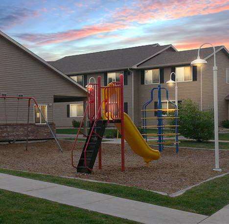 a playground in front of a house