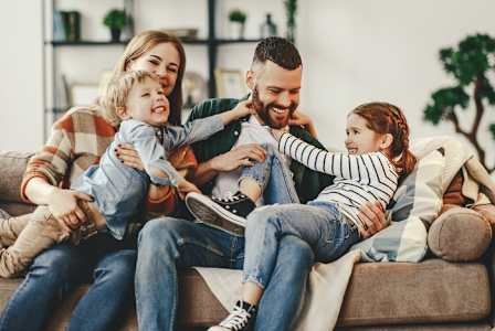 Family setting on sofa at Bella Vista Apartments, Phoenix
