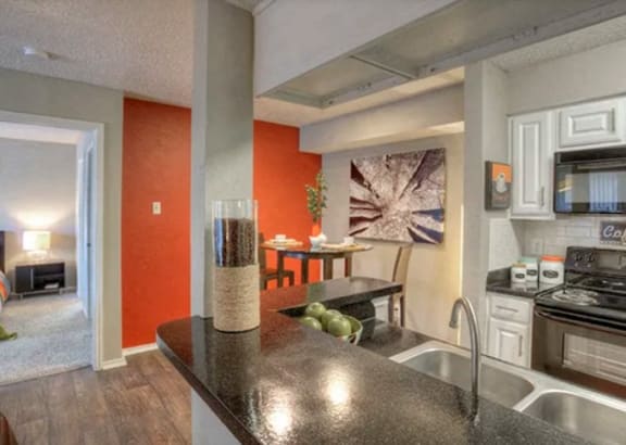 a room filled with lots of different types of exercise equipment at The Manhattan Apartments, Dallas, TX, 75252