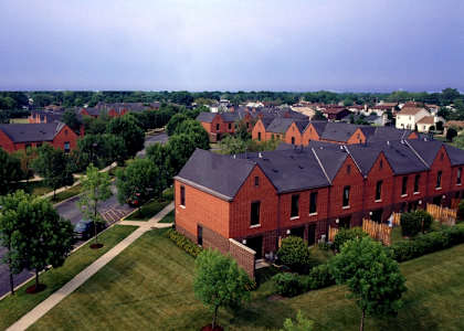 A large housing development with red brick houses.