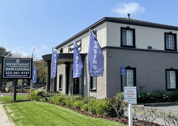 a building with blue and white flags in front of it