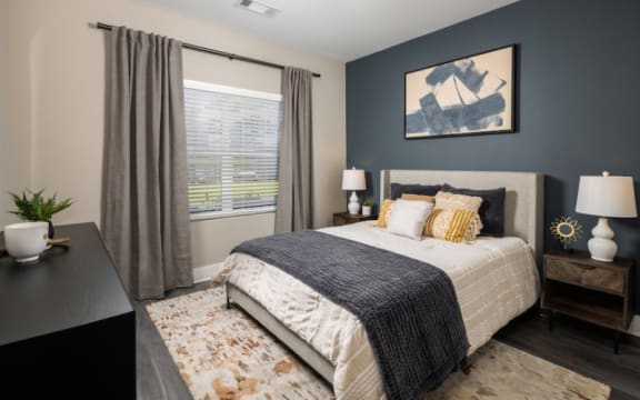 a bedroom with a large bed and a large window at Fairview Springs in Covington, GA, 30016