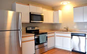 Thumbnail 21 of 22 - apartment kitchen equipped with stainless steel appliances