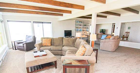 A living room with a couch, chair, and coffee table.