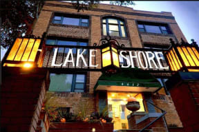 the front of a building with a sign for the cake store
