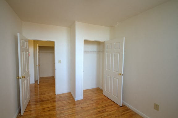 Bedroom with closet and entrance to hallway