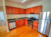 Thumbnail 1 of 8 - Kitchen area with stainless steel appliances