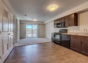 Thumbnail 20 of 29 - Kitchen and Living Area at VINTAGE AT MILL CREEK, Mill Creek, Washington
